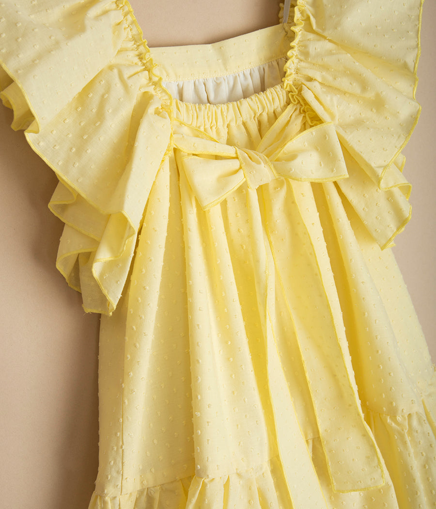 Żółta sukienka z kokardą z tyłu