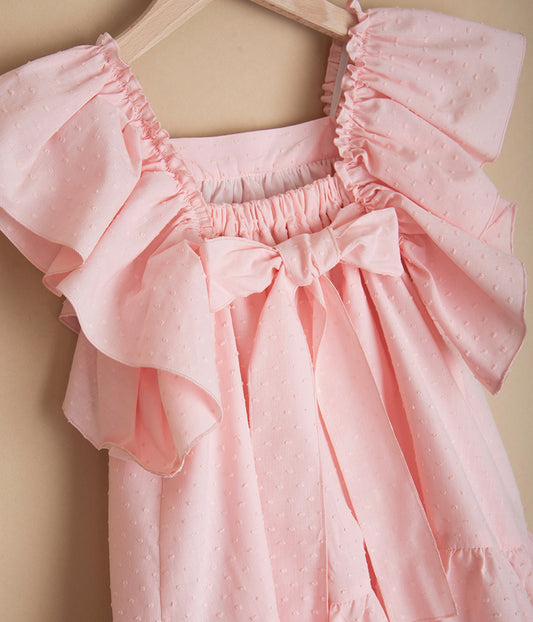 Różowa sukienka z kokardą z tyłu