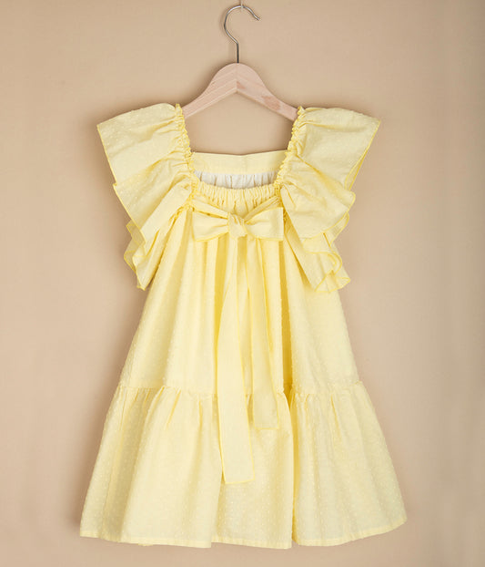 Żółta sukienka z kokardą z tyłu